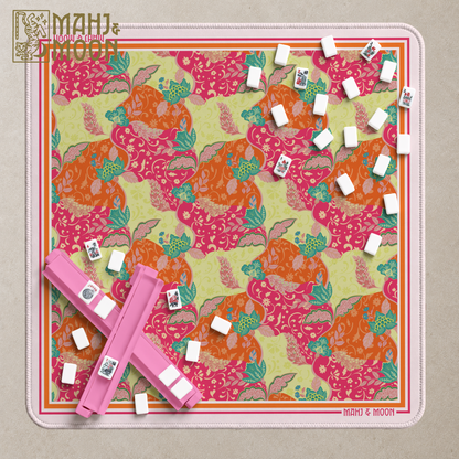 Colorful floral American Mahjong mat with pink, orange, green and teal botanical pattern and striped border.
