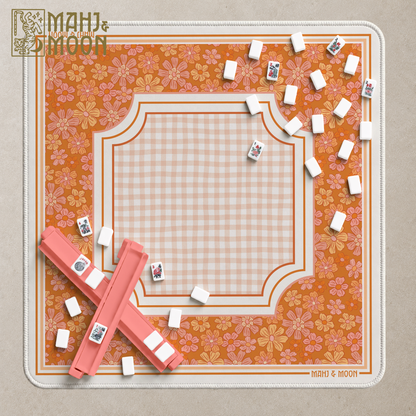 Retro orange floral American Mahjong mat with peach gingham centre, cream border and coral pink Mahjong racks.