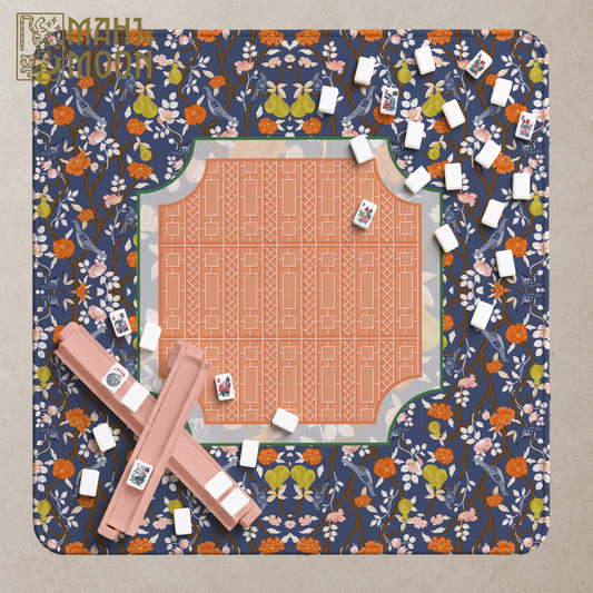 Navy chinoiserie American Mahjong mat with birds, pears, pink and orange flowers and a contrasting coral geometric centre.