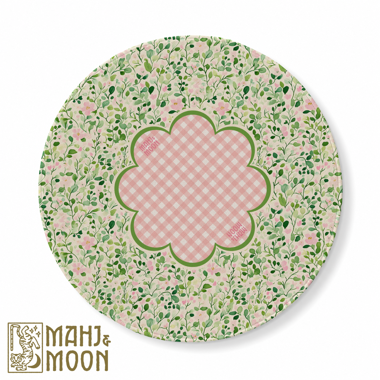 Round American Mahjong mat featuring delicate green leafy vines, blush pink flowers and a pink gingham scalloped centre bordered in green for a charming cottage-inspired game table.