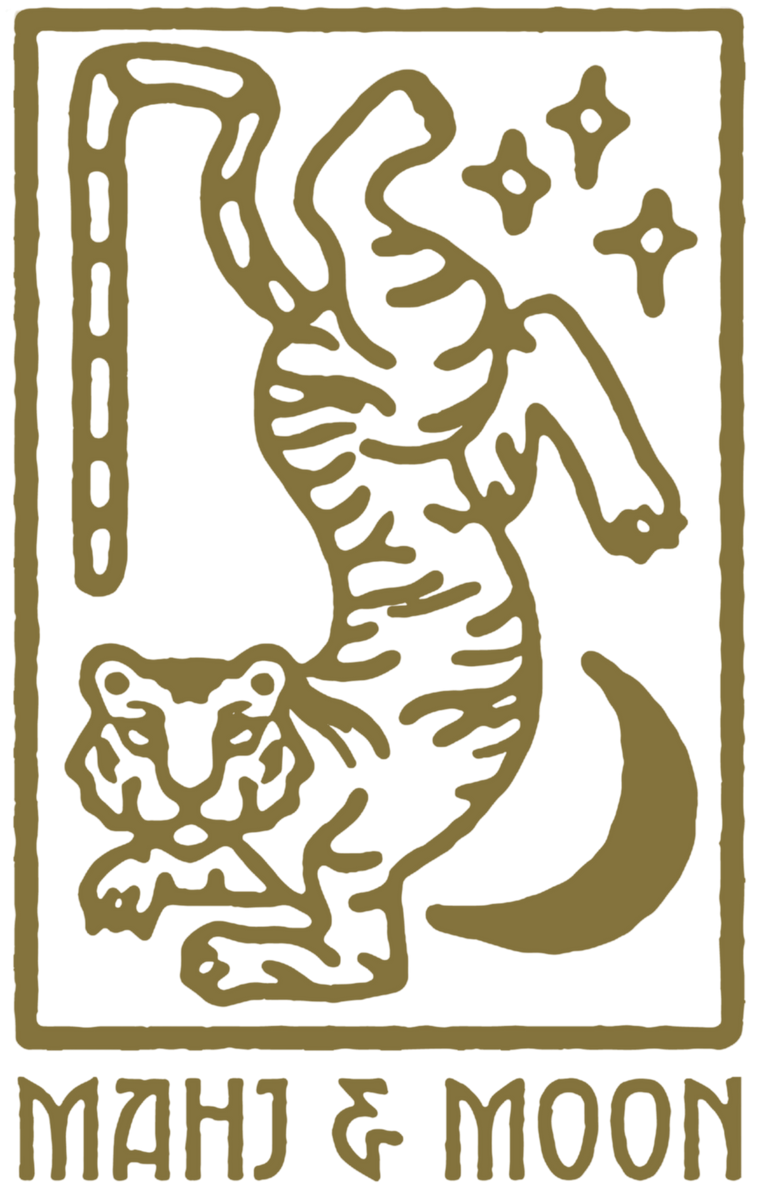 Decorative logo with a tiger and crescent moon, featuring the brand 'MAHJ & MOON'.