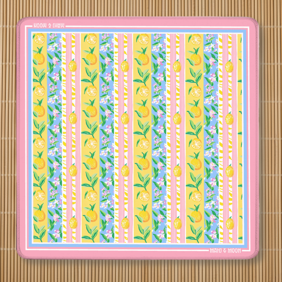 Lemon Stripe American Mahjong mat featuring citrus fruit, floral stripes and a pink border on a premium playing surface.