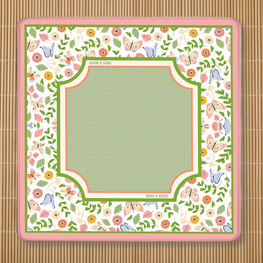 Wildflower Butterfly Mahjong mat featuring butterflies, wildflowers, botanical greenery, and a sage green playing area with a premium non-slip rubber backing.