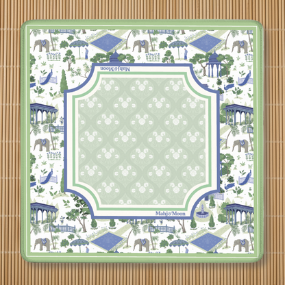 Decorative Mahjong Mat with Green and blue elephant and pagoda pattern, placed on a bamboo surface