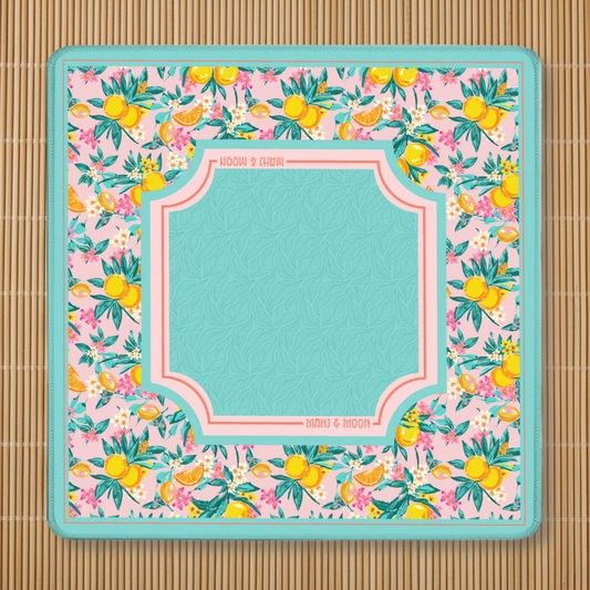 Floral patterned lemon Mahjong pad with a central square area on a bamboo mat background