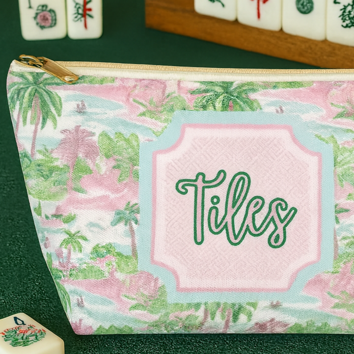 Pink and green tropical-patterned mahjong tile pouch.